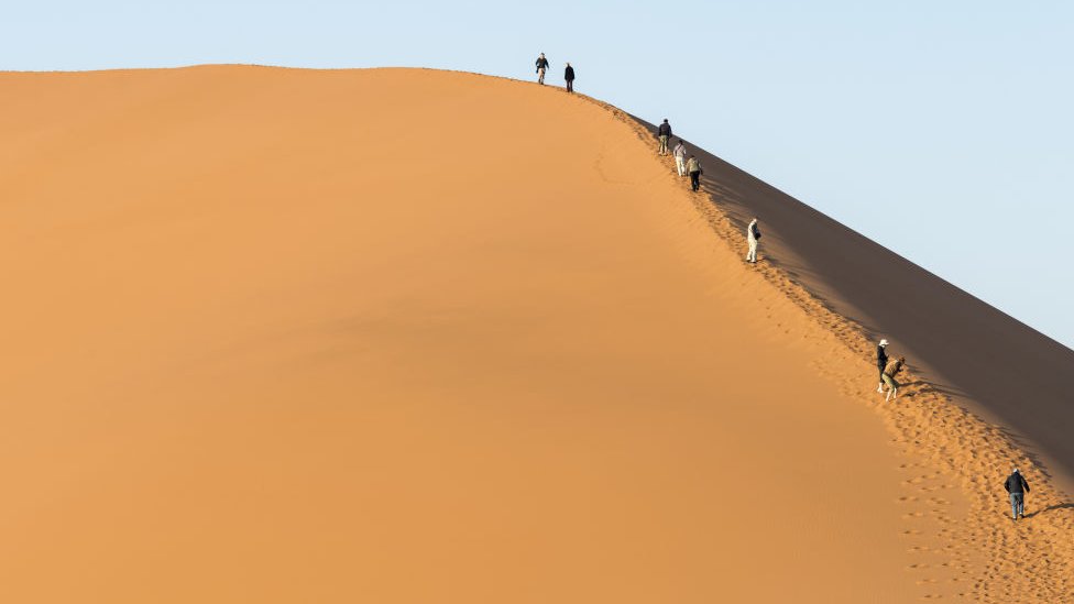 “Namibia Outraged: Tourists’ Nude Photos at Big Daddy Dune Spark Controversy”