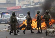 Mozambique Opposition Leader’s Convoy Attacked as Police Crack Down on Protesters