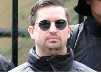 Australia detains South African man after appearance at neo-Nazi rally